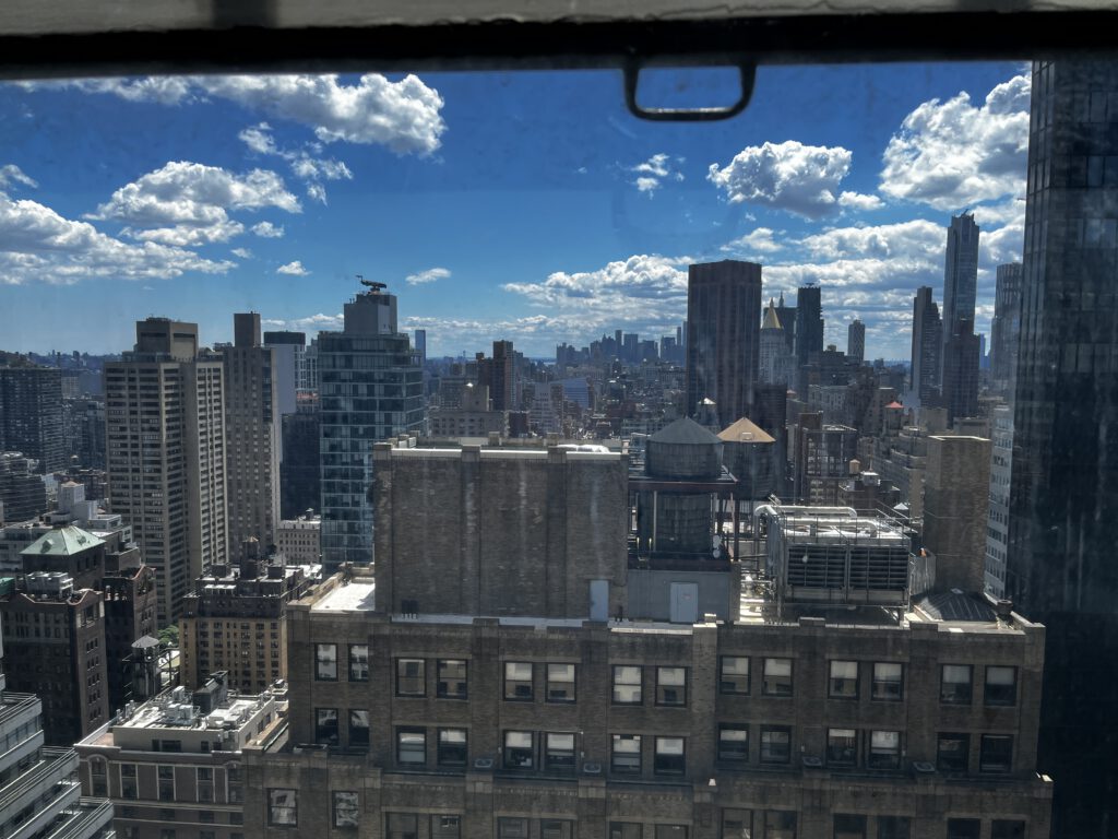 View of Midtown Manhattan skyline from East 42nd Street during a MarcB IT client visit to repair a printer